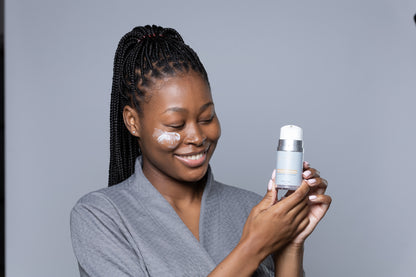 Beauty product promotion: A model showcasing Vyta Aesthetics' brightening night cream, holding the elegantly designed jar while radiating a natural glow, symbolizing the cream's promise of luminous skin.