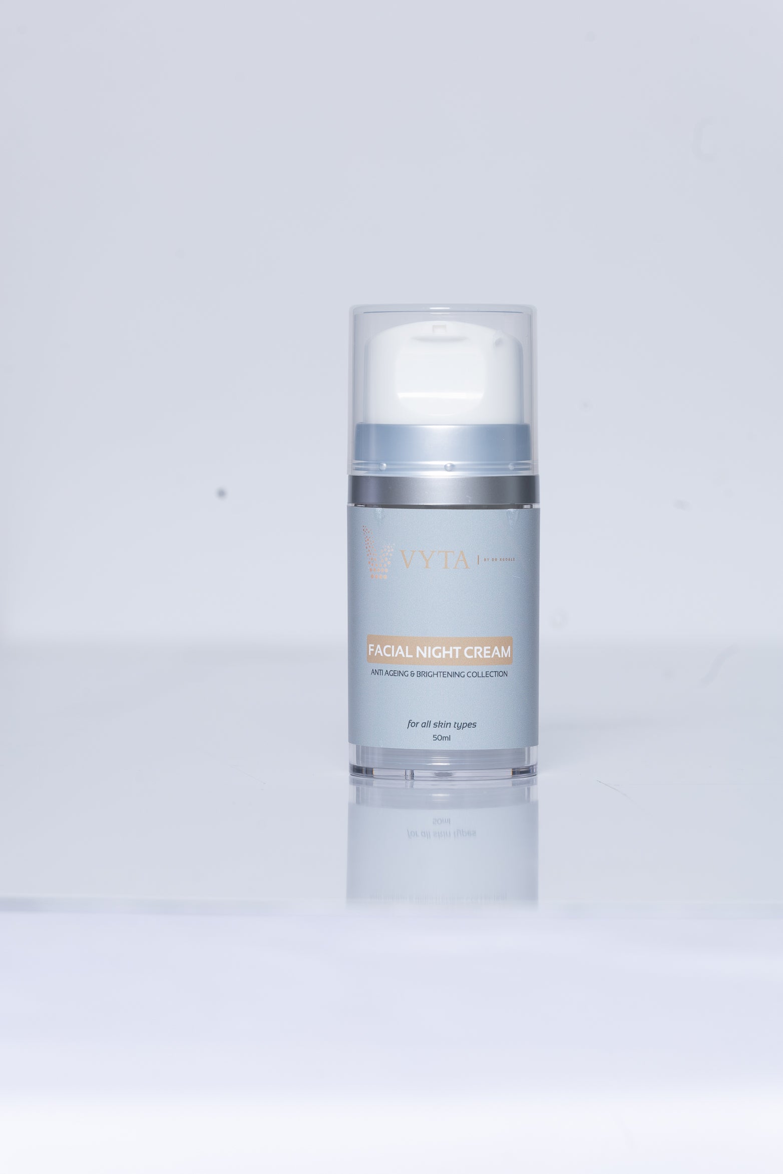 Image of a brightening night cream: A sleek, white jar with a label featuring the product name and benefits, promising to revitalize and illuminate the skin during the night